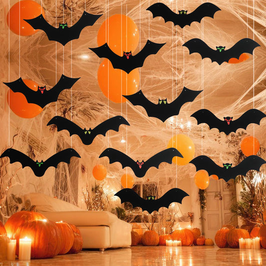 12-piece set of 3D hanging bat decorations with glowing eyes and adhesive strips